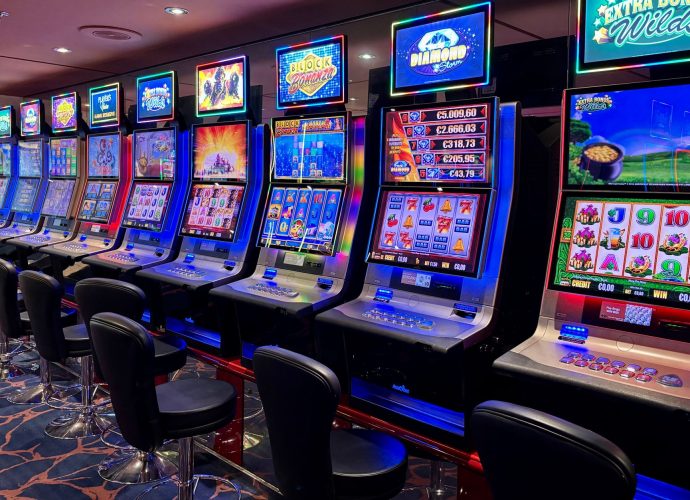 A row of colorful slot machines in a casino.