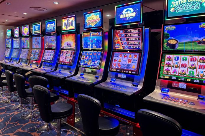 A row of colorful slot machines in a casino.