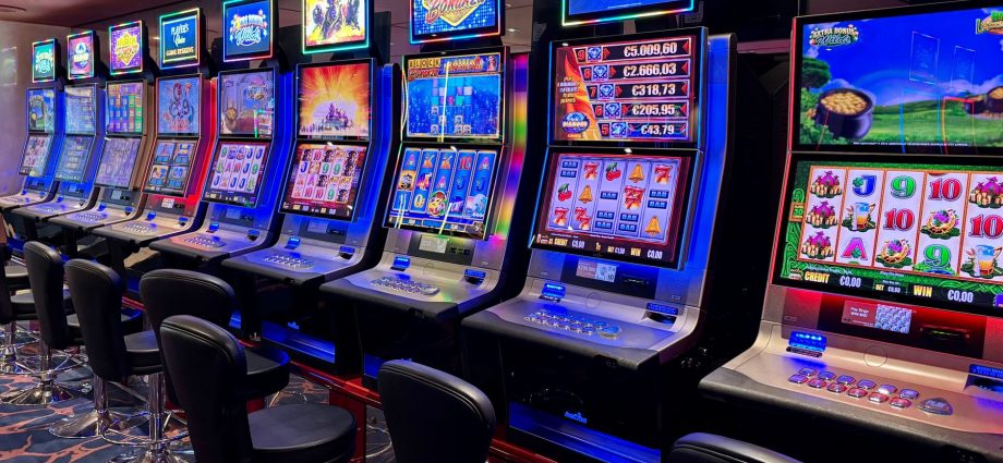 A row of colorful slot machines in a casino.